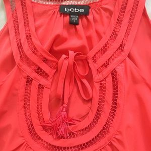 bebe Tops - EUC. Bebe coral tank top size Small bebe Tops - EUC. Bebe coral tank top size Small